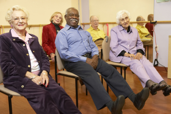 group of seniors sitting and smiling